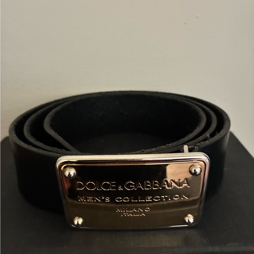 Dolce & Gabbana black men's calfskin belt with gold-tone logo plaque buckle.